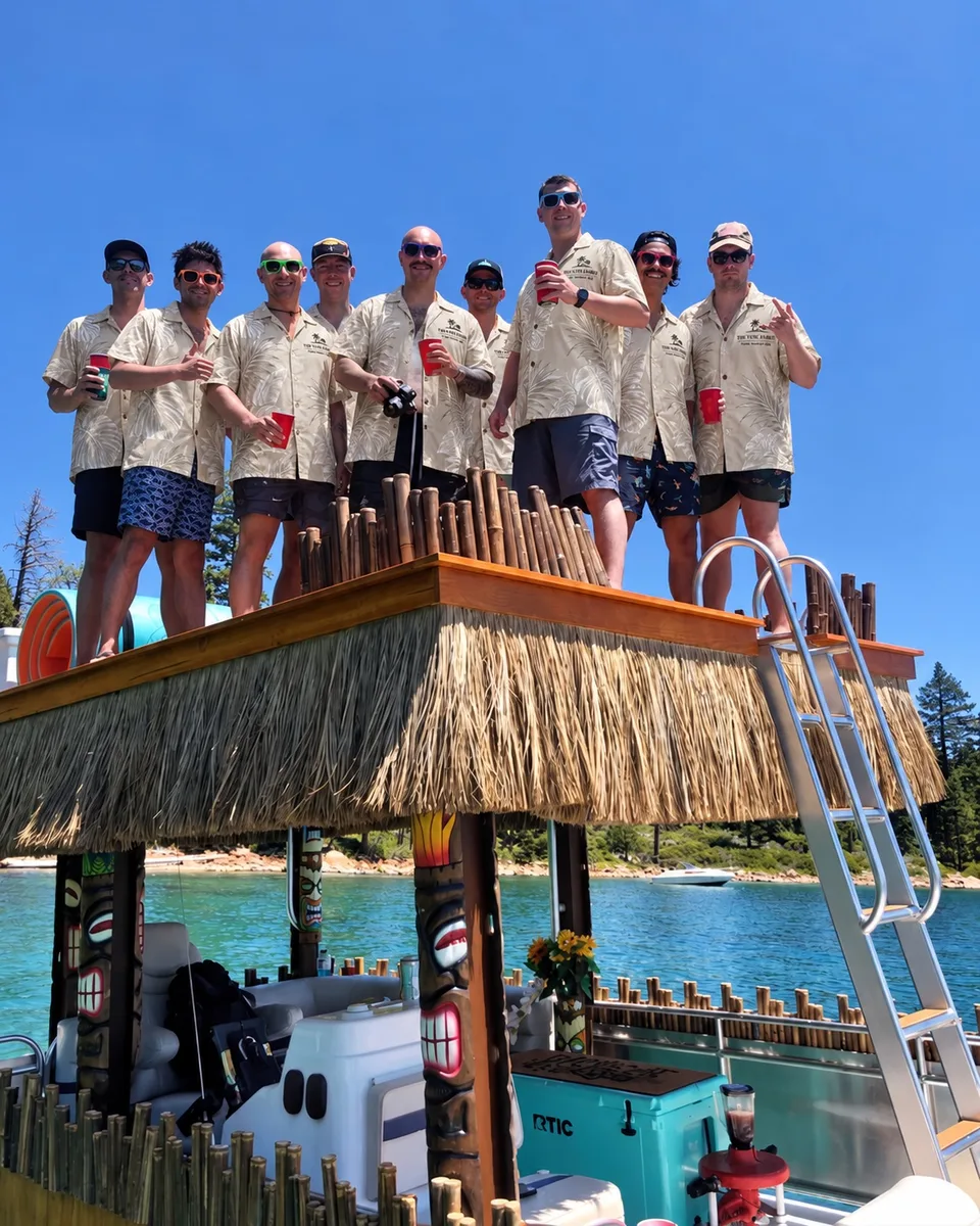 Boat party group in custom shirts on a tiki deck