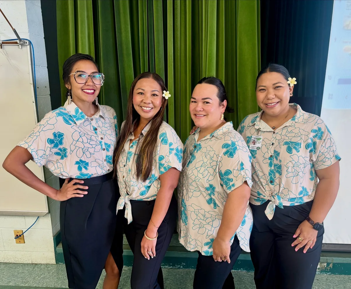 Hospitality staff in light floral shirts